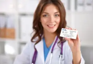 Female-doctor-holding-a-Creorx-prescription-card